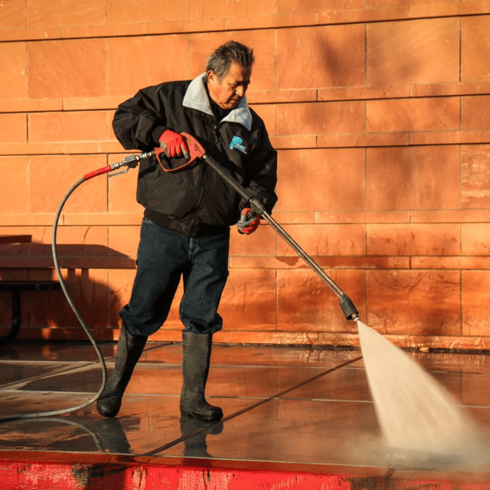 New Project (11) a man holding a hose with a hose spraying water
